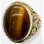Large 9ct gold signet ring set with tigers eye cabouchon, size V, 12.1g. P&P Group 1 (£14+VAT for