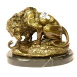 Bronze lion and snake figural group on a marble base, 21 x 28 cm. Not available for in-house P&P
