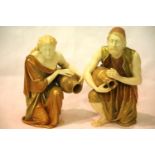 A pair of Royal Worcester figures of water carriers, after James Hadley, H: 25 cm, no visible chips,