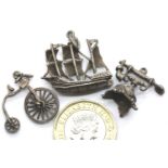 Three vintage silver assorted charms. P&P Group 1 (£14+VAT for the first lot and £1+VAT for