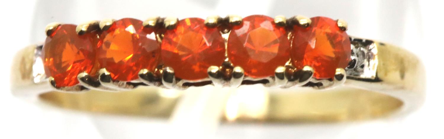 9ct gold ring with five orange stones and diamonds, size O, 1.6g. P&P Group 1 (£14+VAT for the first