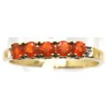 9ct gold ring with five orange stones and diamonds, size O, 1.6g. P&P Group 1 (£14+VAT for the first
