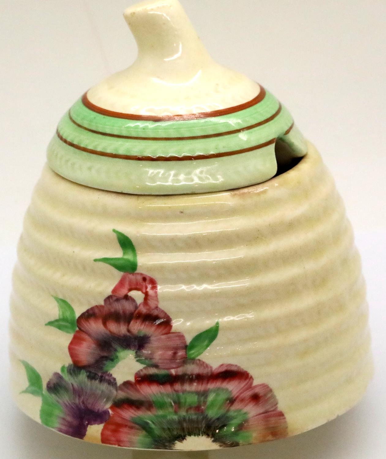 Clarice Cliff lidded Wilkinsons honey pot, H: 12 cm. P&P Group 2 (£18+VAT for the first lot and £3+