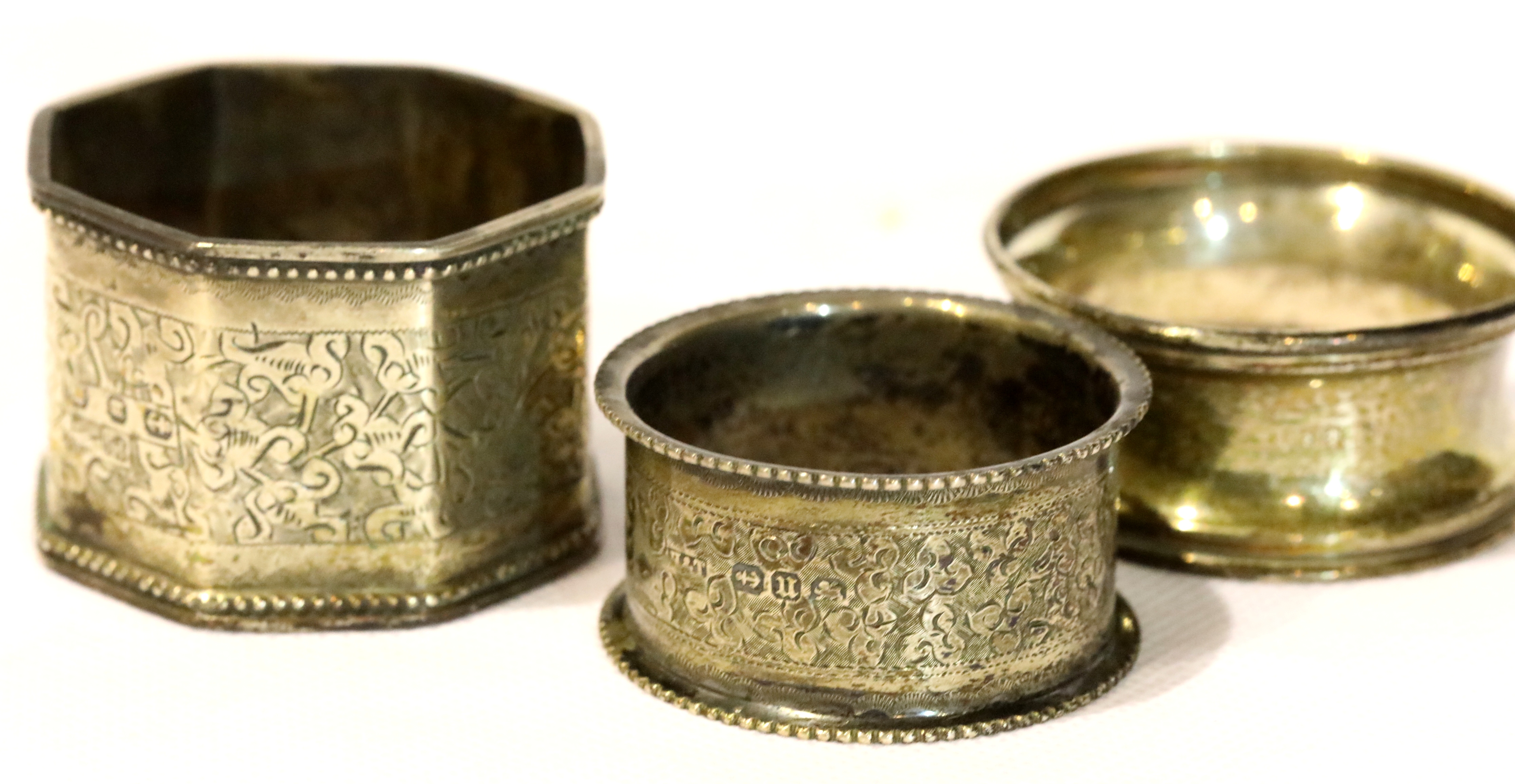 Three hallmarked silver napkin rings, combined 48g. P&P Group 1 (£14+VAT for the first lot and £1+