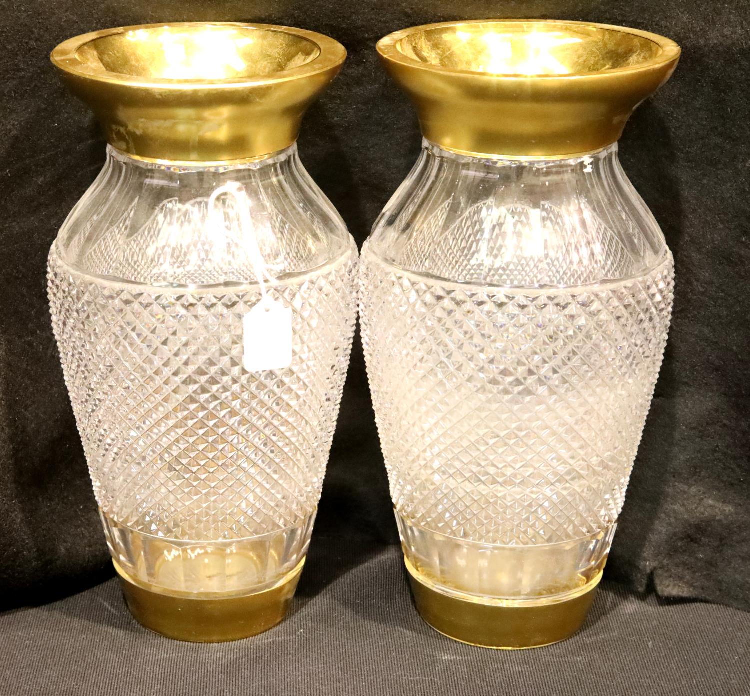 Pair of large French heavy cut glass baluster vases, with gilt rims and bases, one small chip to one