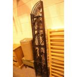 Pair of wrought iron leaf patterned corner stands. Not available for in-house P&P