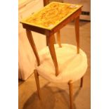 Decorative sewing table with contents and an upholstered top collapsible seat. Not available for