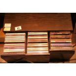 Three drawer CD unit containing four varied selections of CDs including Cher, the Cranberries and