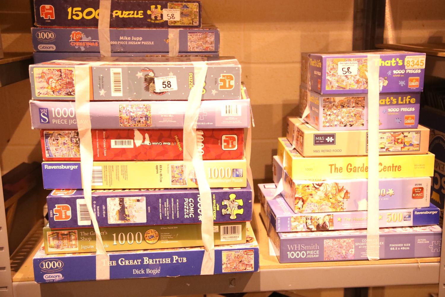 Large quantity of assorted boxed jigsaws, approximately 24 in total. Not available for in-house P&P