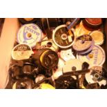 Box of mixed fishing reels and spools. Not available for in-house P&P