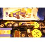 Plastic tool box of various bits of Meccano and modeling books 1, 4 and 5. Not available for in-