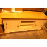 Modern beech type television cabinet with two cupboards, L: 140 cm. Not available for in-house P&P