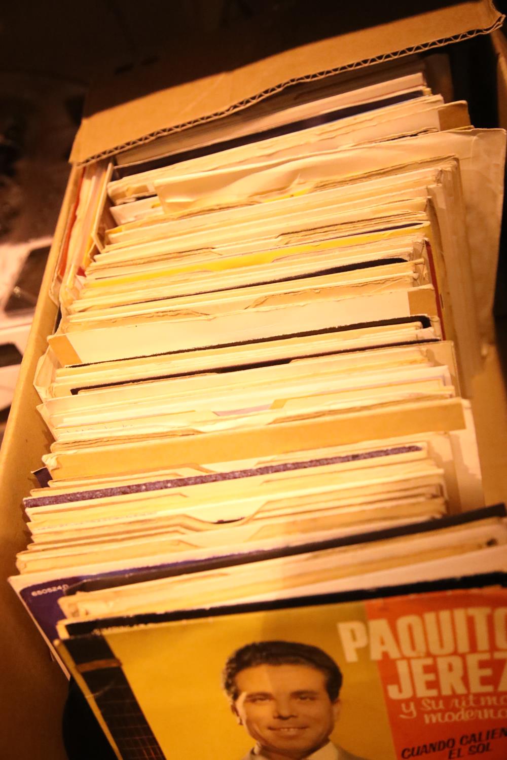 Box containing a large selection of 7" vinyls including Sacha Distel, the Ventures etc. Not
