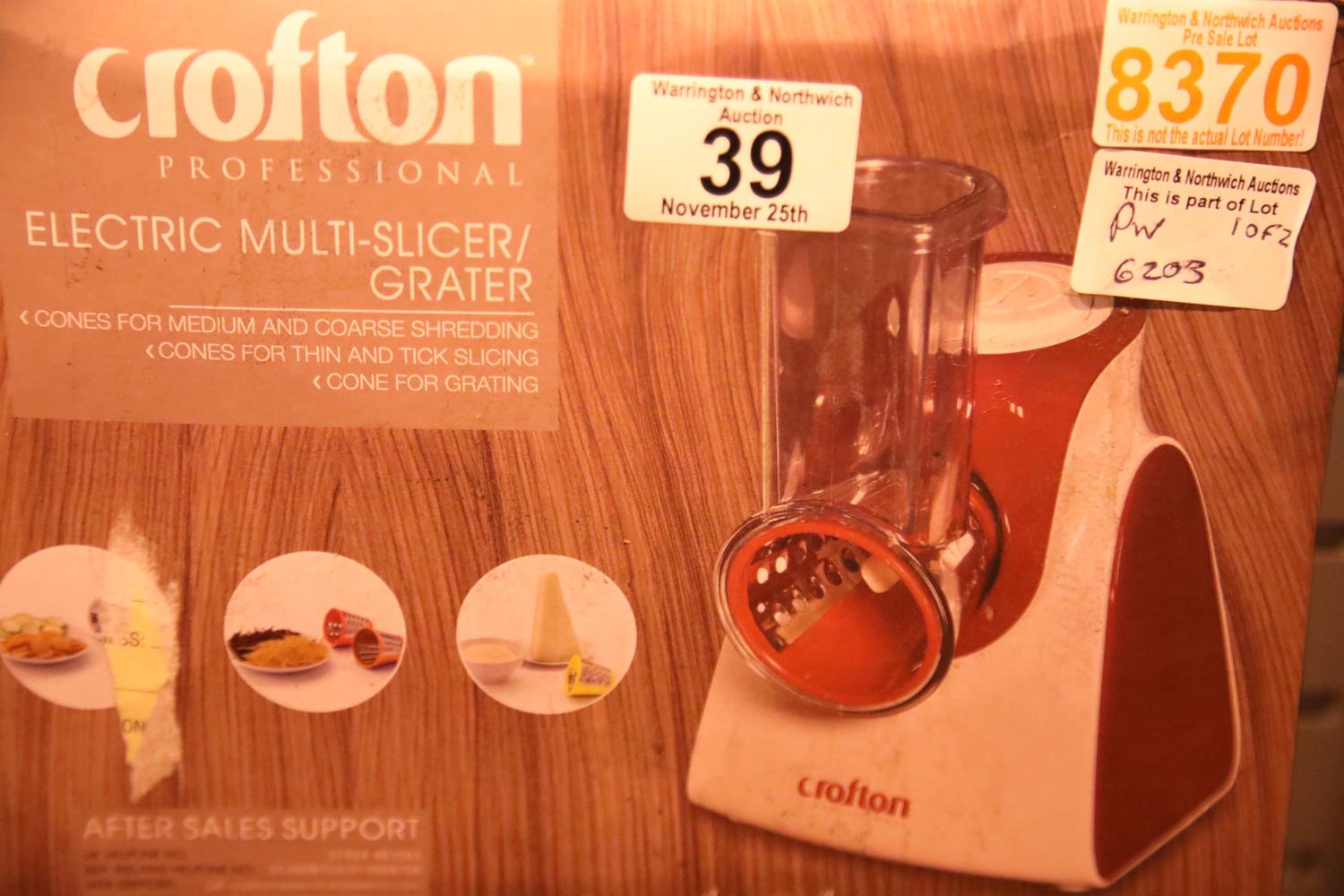 Two boxed crofton electric multi slicer/graters. Not available for in-house P&P