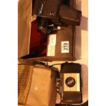 Cased Kodak 127 camera and a Halina hand held Super 8 cine camera. Not available for in-house P&P