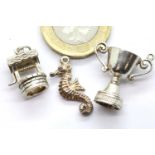 Three 1970s silver charms. P&P Group 1 (£14+VAT for the first lot and £1+VAT for subsequent lots)