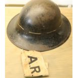 British WWII type ARP black helmet, dated inside 1941, with an ARP armband. P&P Group 2 (£18+VAT for
