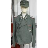German WWII type SS Panzer representation, comprising wrap tunic with awards, trousers and cap. P&