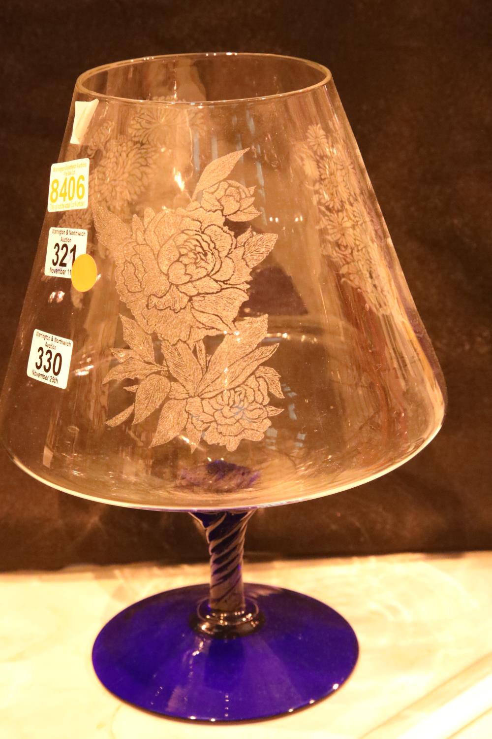 Large floral etched drinking glass and a blue coloured stem with base. Not available for in-house