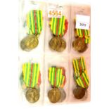 Twenty-four Merit medals from Zaire. P&P Group 1 (£14+VAT for the first lot and £1+VAT for