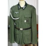 German WWII type representation comprising an M36 tunic with marksman lanyard and awards. P&P