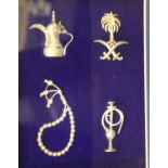 Framed display of Middle-Eastern silver miniatures. P&P Group 2 (£18+VAT for the first lot and £3+