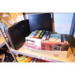 Box of mixed items including books, PC monitor and an attache case. Not available for in-house P&P