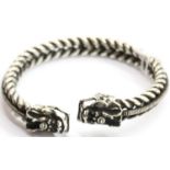 White metal Tibetan silver twisted bangle with dragon head finials. P&P Group 1 (£14+VAT for the