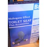 New old stock B&Q mahogany effect toilet seat in wrapping. Not available for in-house P&P