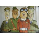 Four large cartoon military figurines, on card, H: 100 cm. Not available for in-house P&P