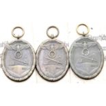 Three German WWII type West Wall medals in packets of issue. P&P Group 1 (£14+VAT for the first
