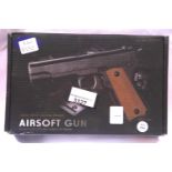 Airsoft V11 tan coloured hand gun, boxed. P&P Group 2 (£18+VAT for the first lot and £3+VAT for