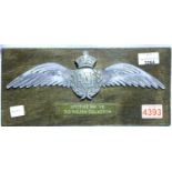 Commemorative cast aluminium RAF wings wall plaque, mounted on wood board, dedicated to Spitfire