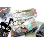 A large quantity of worldwide military badges, epaulettes, patches, shoulder titles etc, mainly