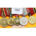 Set of four Russian Soviet Anniversary medals and a Labour Veterans medal. P&P Group 1 (£14+VAT