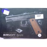 Airsoft V11 tan coloured hand gun, boxed. P&P Group 1 (£14+VAT for the first lot and £1+VAT for