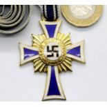 Boxed German Third Reich type Mother's Cross in gold, dated 16 December 1938 verso. P&P Group 1 (£