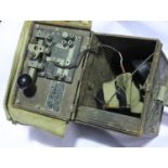 Small field communications box containing earpieces and Morse machine. P&P Group 3 (£25+VAT for