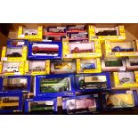 Twenty five boxed OO scale vehicles, wagons, cars, vans, bus from Classix, BT models, Trackside etc.