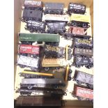 Twenty five unboxed OO wagons, Hornby/Bachmann etc, tankers, vans, PO etc and crane match trucks.