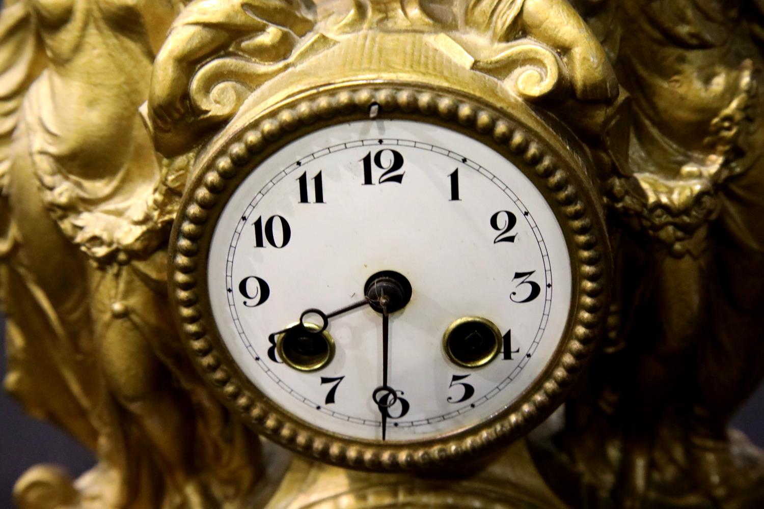 Antique gilt cast metal chiming clock depicting two Grecian ladies in full dress either side of - Image 2 of 3