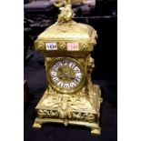 A 19th century French ormolu and lacquered brass 8 day table clock, chiming on a gong, circa 1870,