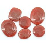 Six intaglio carved carnelian panels of varying size, largest 21 x 17 mm. P&P Group 1 (£14+VAT for