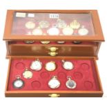 Three drawer watch display case containing nineteen various pocket watches. Not available for in-