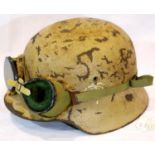 WWII German M35 Afrika Korps Helmet and liner with goggles. The nose of the goggles has had a