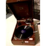 Vintage red leatherette HMV gramophone, working and complete. Not available for in-house P&P