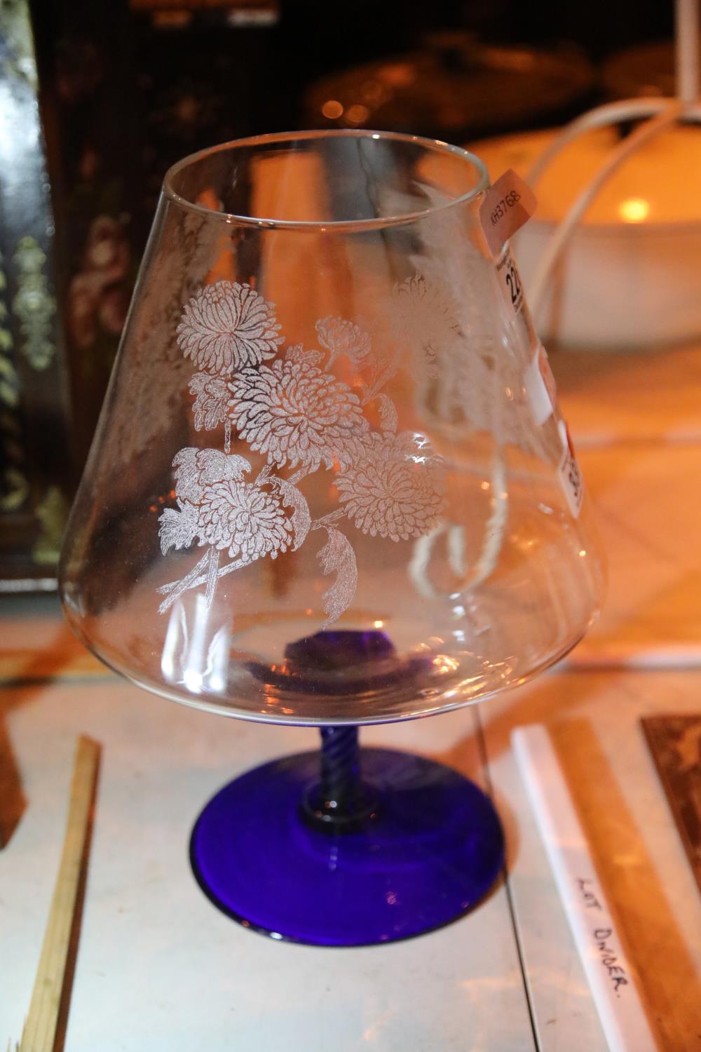 Large floral etched drinking glass and a blue coloured stem with base. Not available for in-house