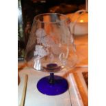 Large floral etched drinking glass and a blue coloured stem with base. Not available for in-house