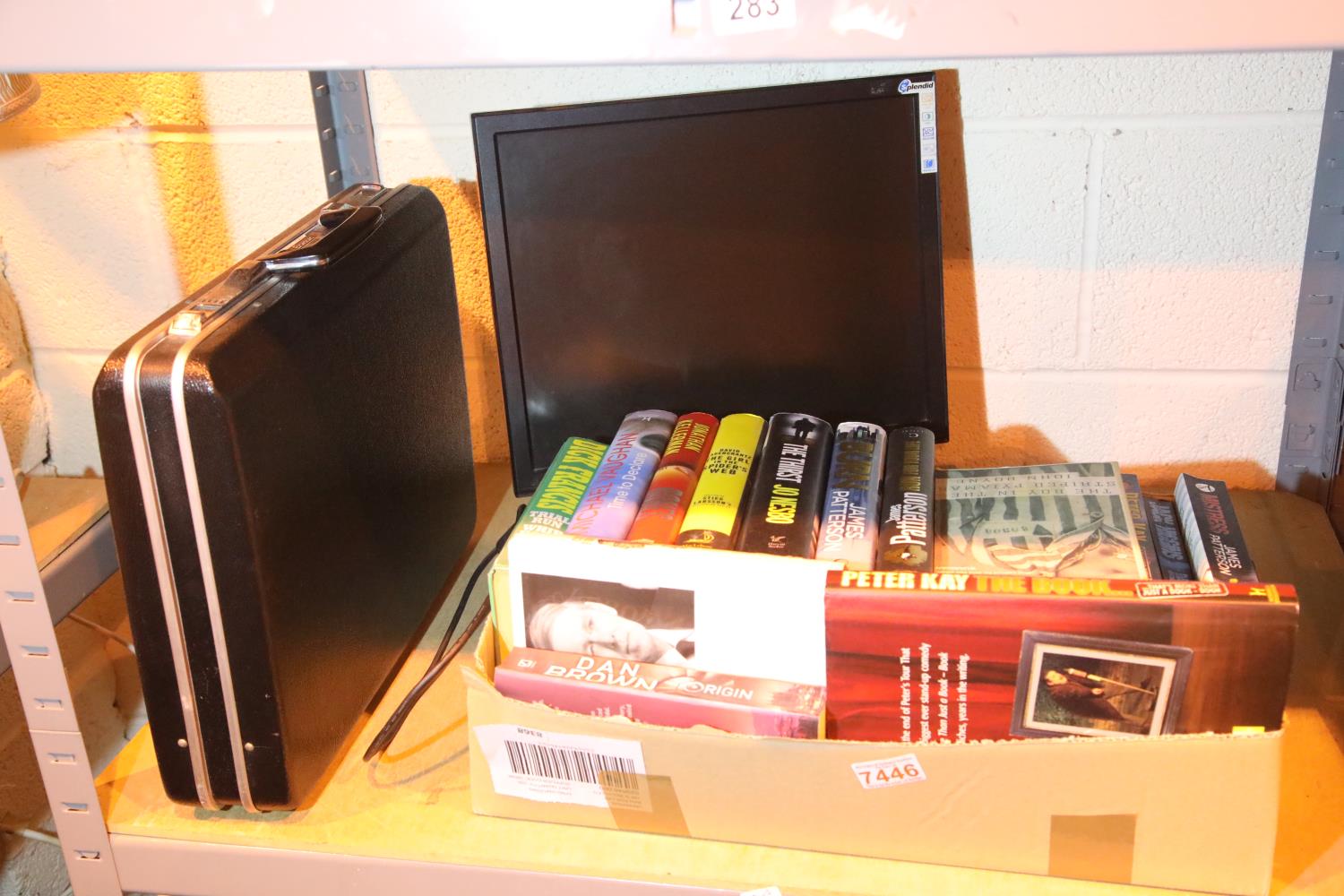 Box of mixed items including books, PC monitor and an attache case. Not available for in-house P&P