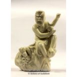 A Chinese Blanc De Chine Figure Of A Buddha Seated On A Rock, 15cm.